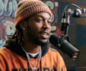 Artist at a podcast mic